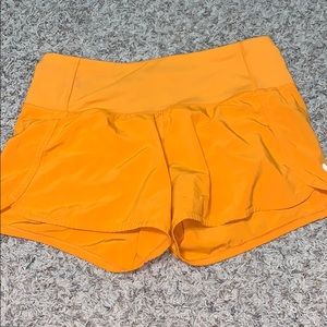 Orange lululemon shorts